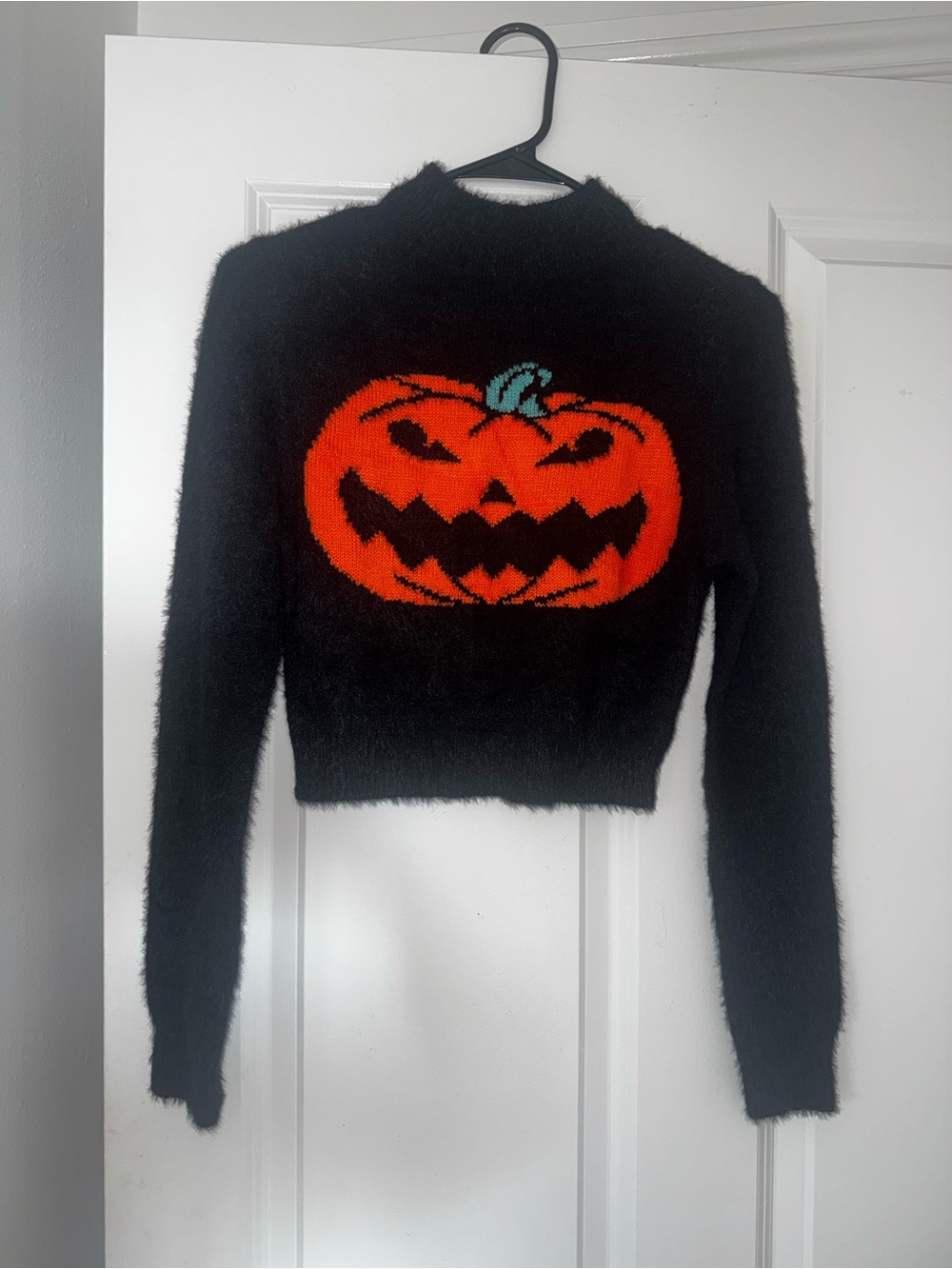 Cider Black Fuzzy Cropped Sweater with Orange Pumpkin Motif